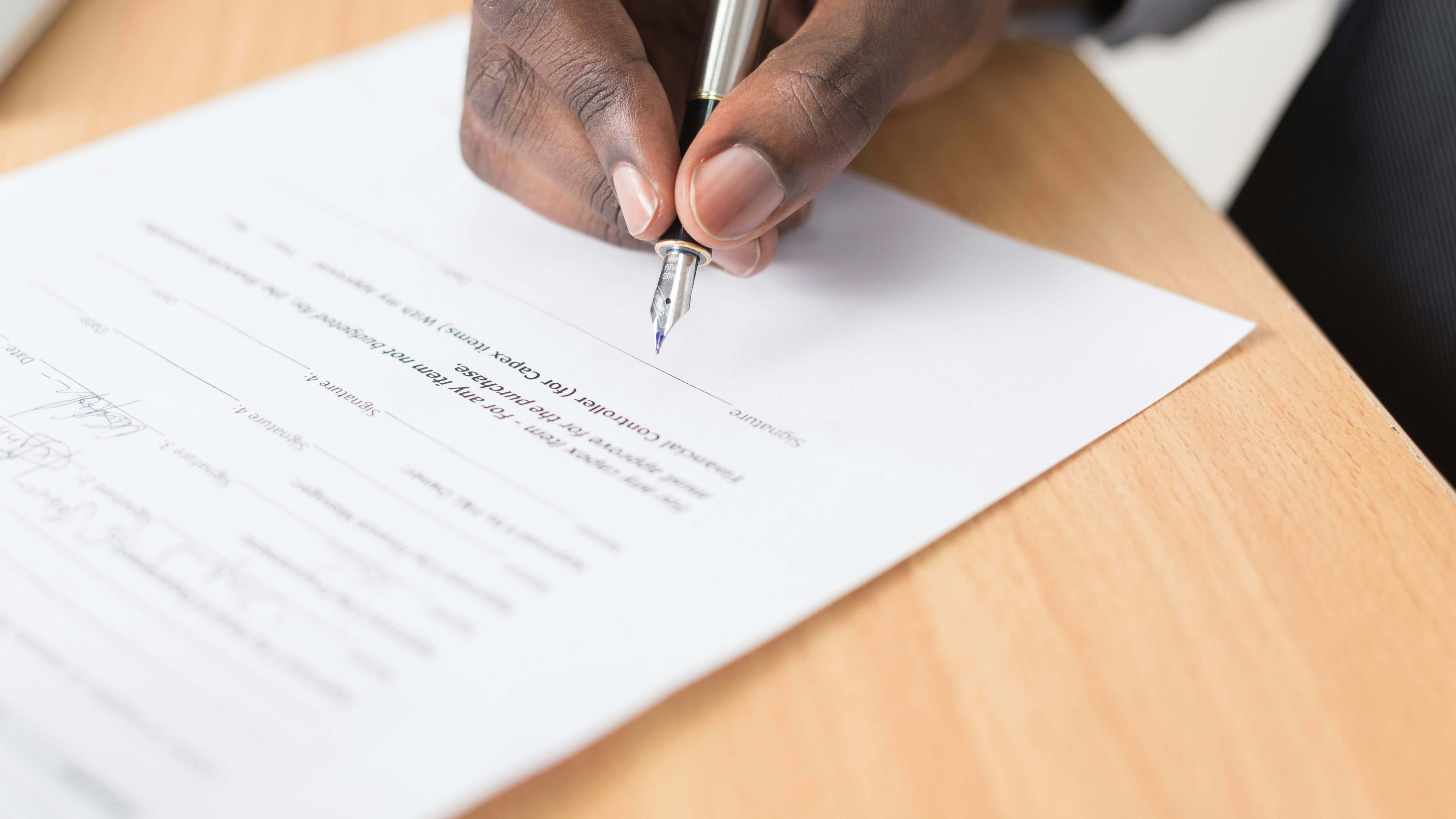 Image of a document being signed