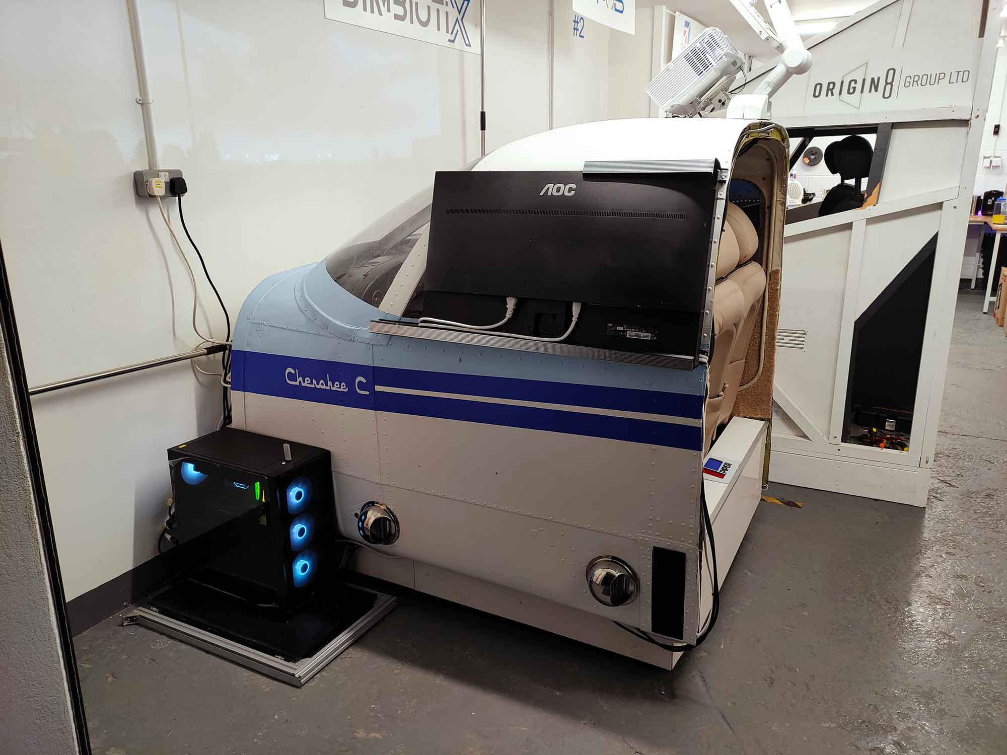 a view of a flight simulator, the simulator is in the form of a cockpit