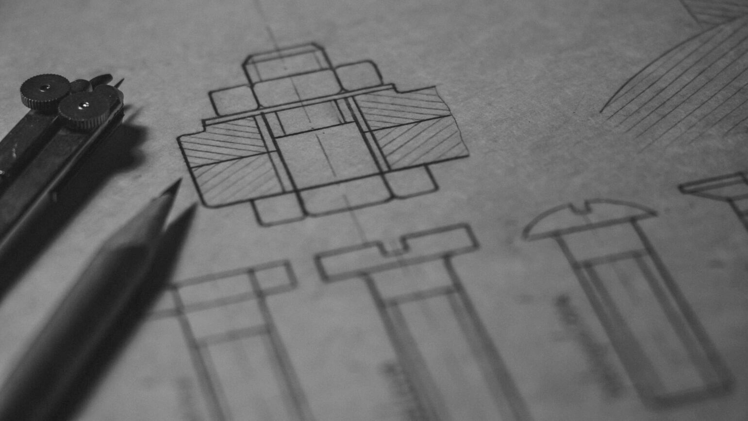 Image of some sketches with a pencil and compass